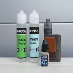 Flacons de e-liquide menthe et booster de nicotine, avec une cigarette électronique. Le propylène glycol, composant principal, peut présenter un danger s'il est mal utilisé.
