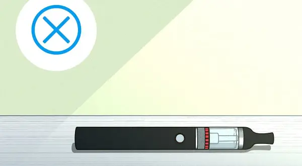 Une cigarette électronique noire est posée sur une surface. Un cercle blanc avec une croix bleue indique que le vuse clignote 3 fois, signalant un problème.